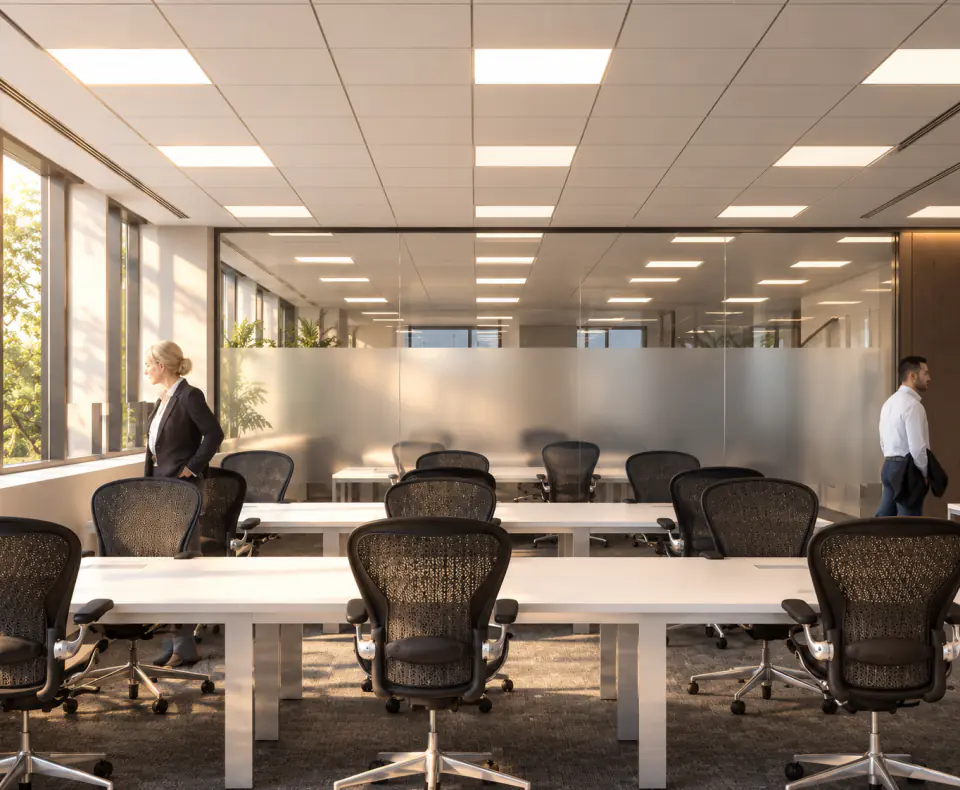 Training room with white tables and task chairs