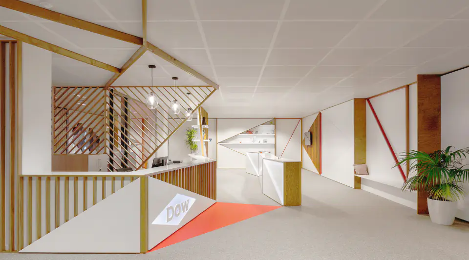 Reception desk with diagonal timber slats and red floor graphics