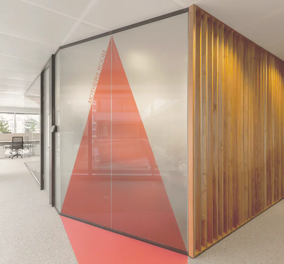 Glazed meeting room with a red triangular graphic