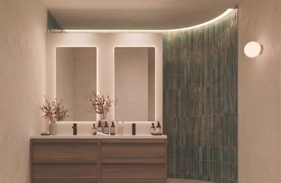 Bathroom with twin mirrors and curved green tiles