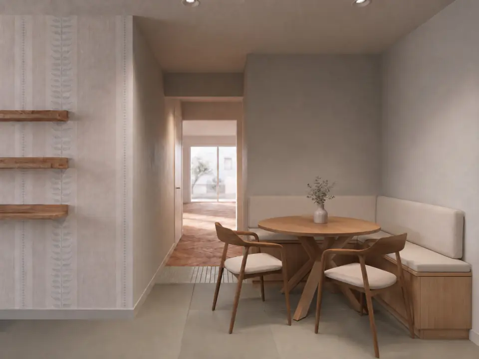 Dining corner with a round table and wallpapered walls