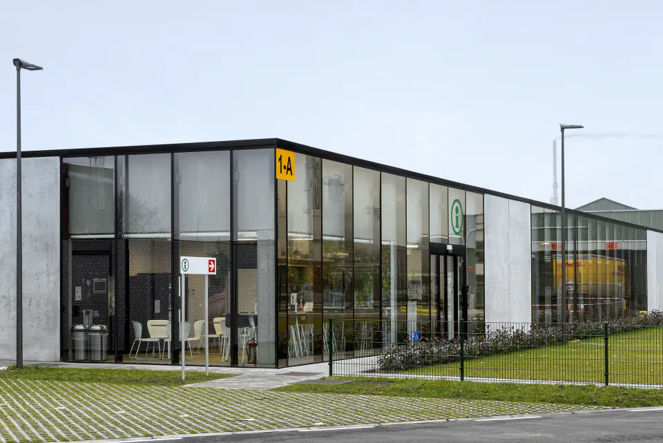 Glazed entrance corner with a yellow Shell sign